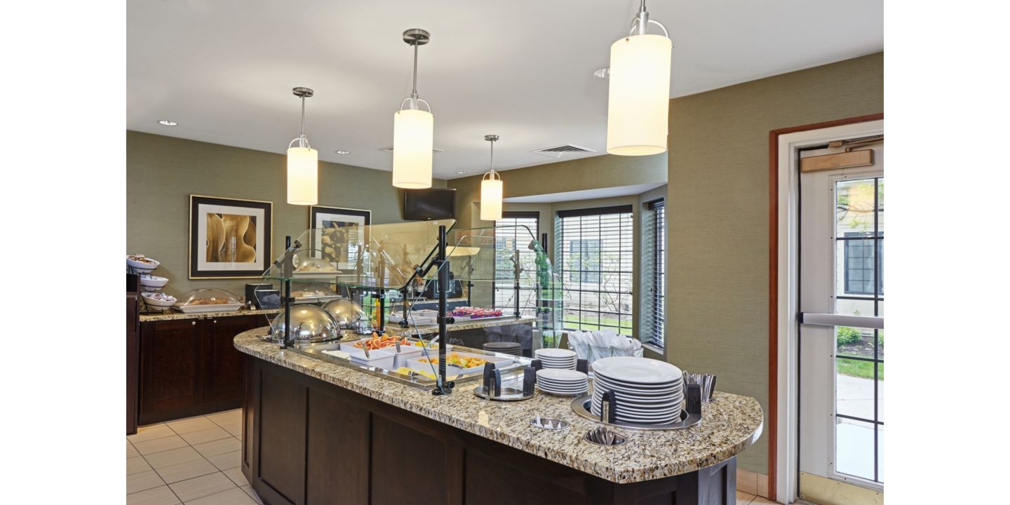 Indulge in a complimentary hot breakfast during your stay at Staybridge Suites Glenview! Each morning, savor a delightful array of options, including scrambled eggs, sausage or bacon, a yogurt parfait station, a make-your-own waffle station, cereals, fresh breads, delicious blueberry muffins, oatmeal, and much more. You'll find everything you need.